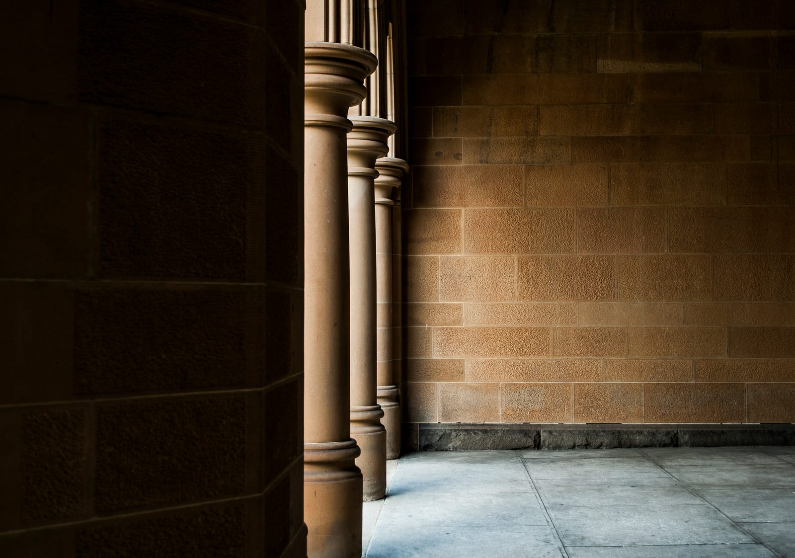Sandstone columns and stone wall of a heritage government building